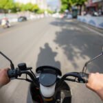 man riding electric bike in city