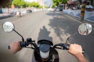 man riding electric bike in city
